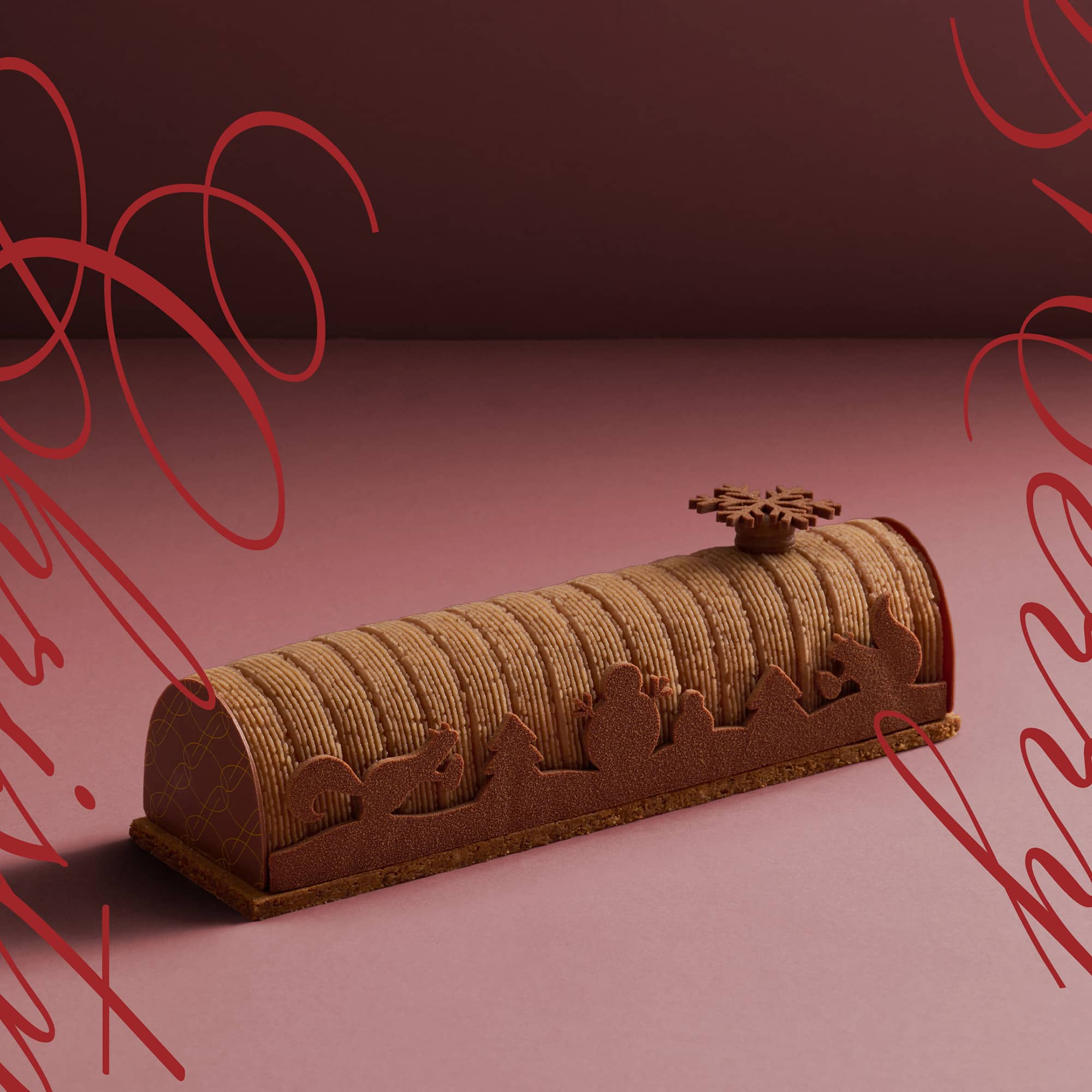 A 2023 Christmas log cake, the Chestnut Mont Blanc with Christmas themed chocolate decoration by the sides